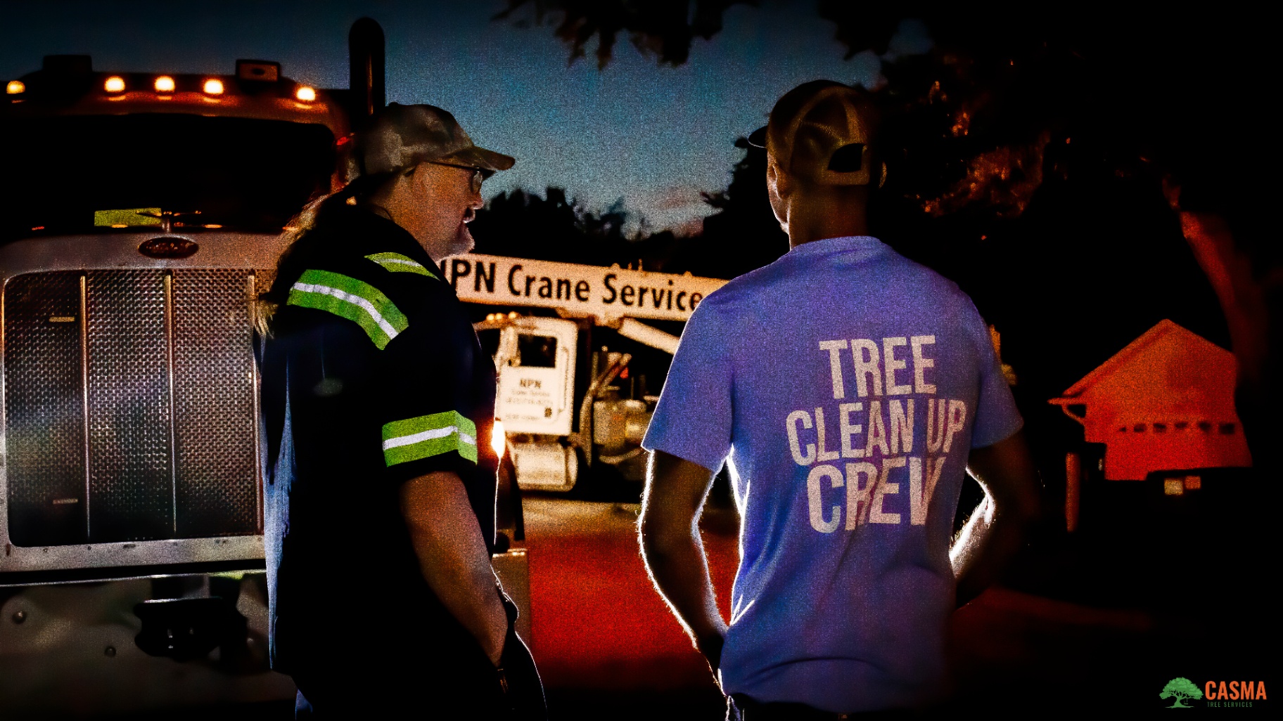 Casma Tree Cleanup Crew at dusk in front of crane truck